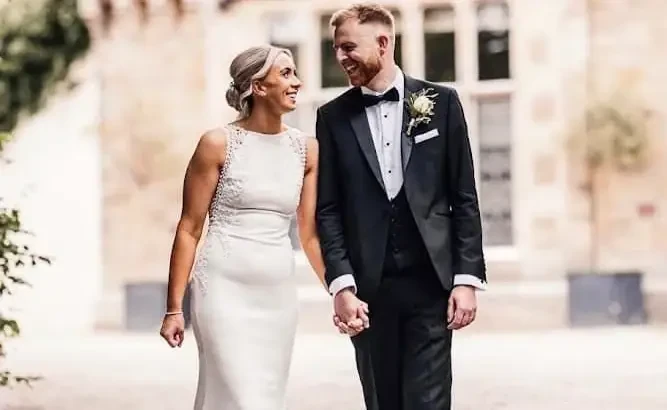 Couple wearing a white gown, shirt and shorts